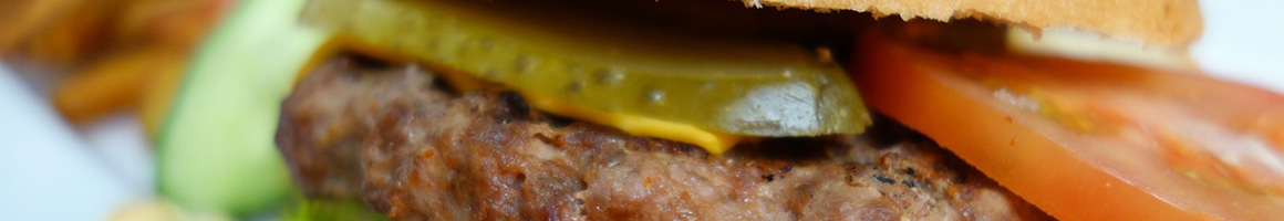 Eating American (Traditional) Burger at Sanford's Grub & Pub restaurant in Dickinson, ND.